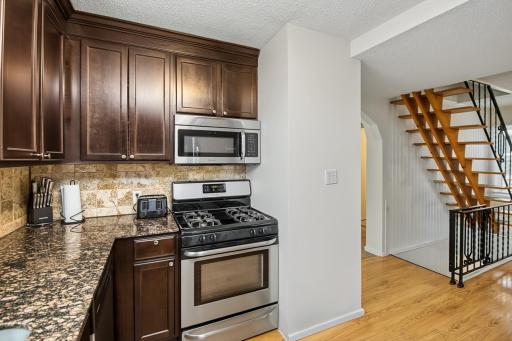 Very attractive kitchen with granite counter and stainless appliances