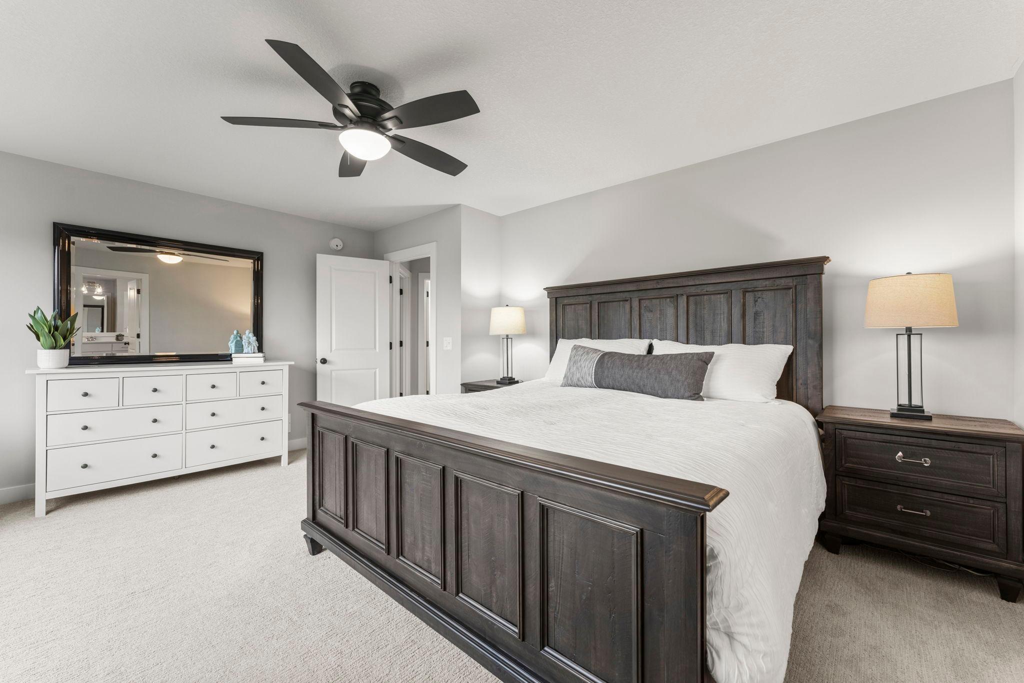 The room comfortably accommodates a king-size bedroom set.