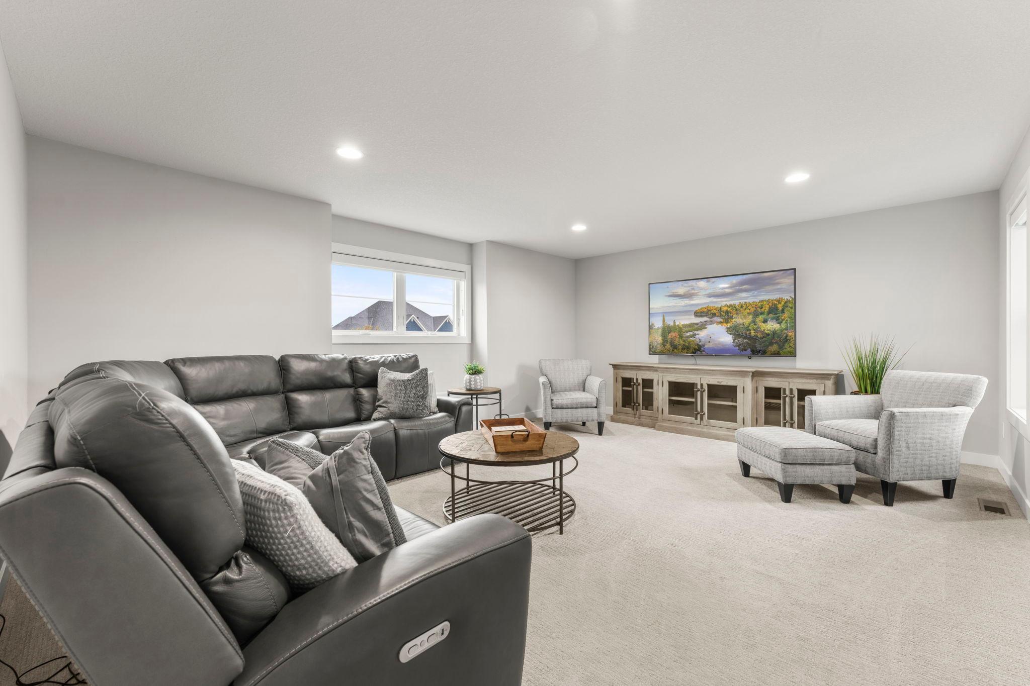 A second family room on the upper level creates valuable flexibility — another place to relax, gather, work, or simply spread out.