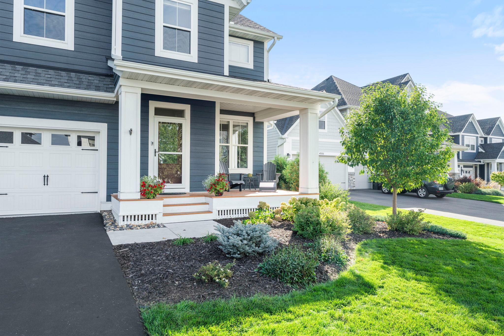 The covered front porch is the perfect place to catch up with neighbors or enjoy your favorite beverage.
