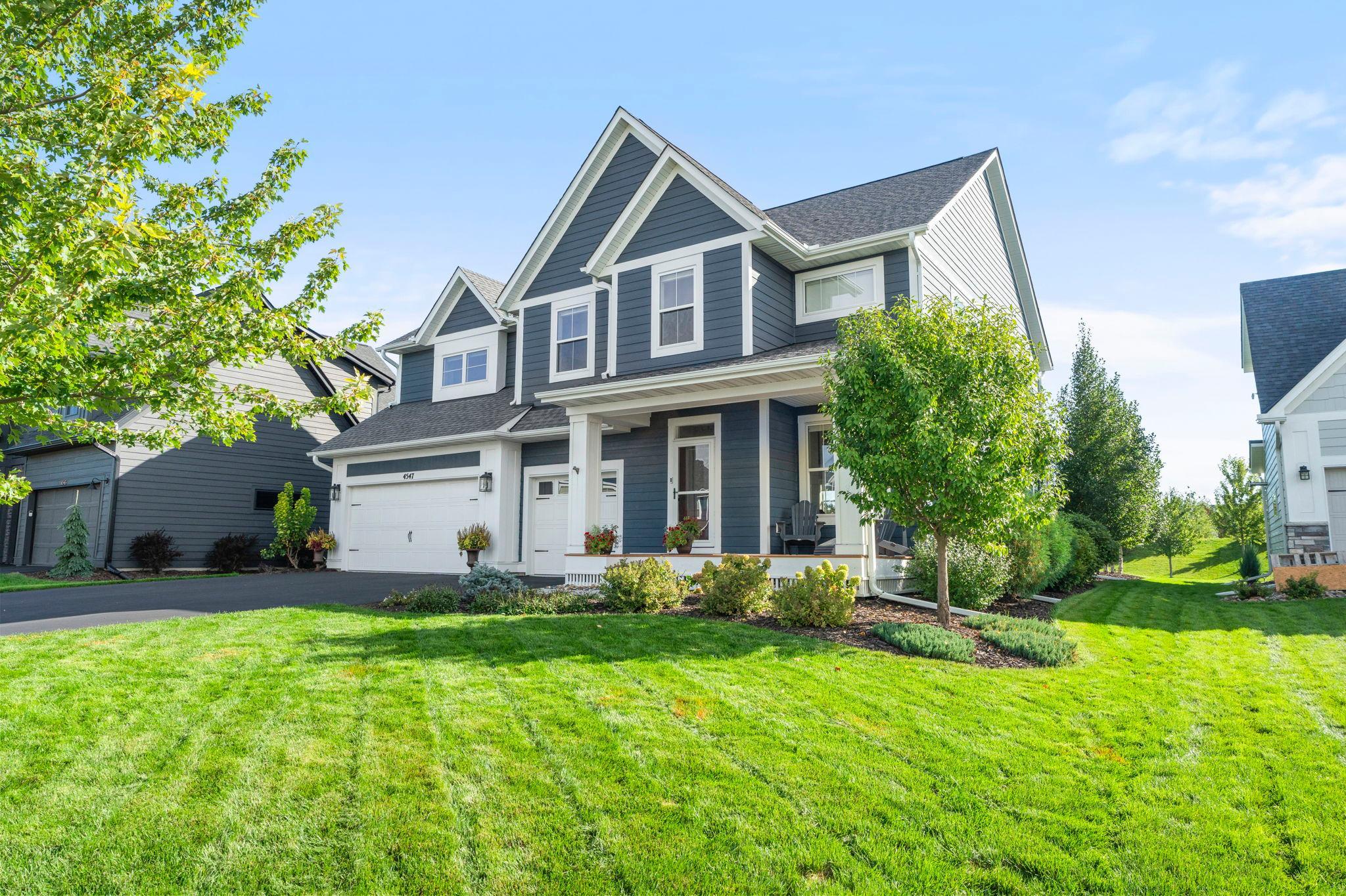 This home features beautiful landscaping and a large, flat backyard with a privacy berm and no neighbors behind. The backyard includes a large paver patio and a hot tub. It's a perfect place to entertain.
