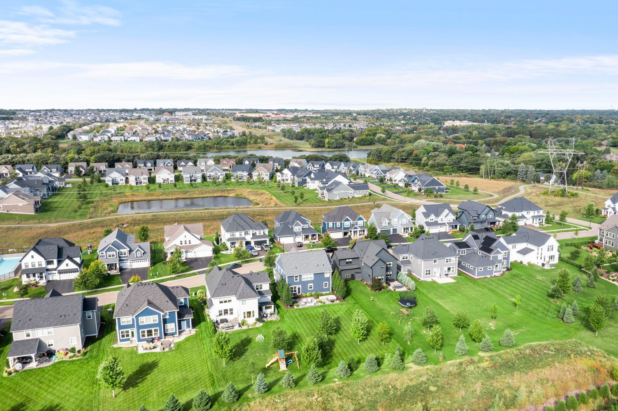Another aerial view of the backyard and neighborhood.