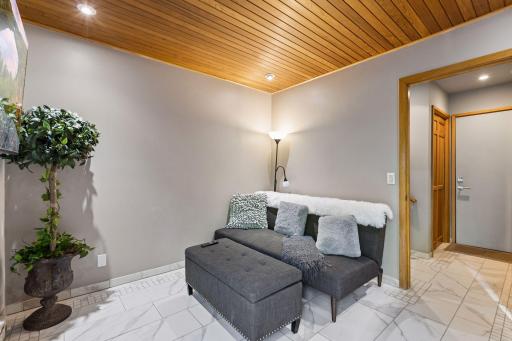 The lower-level family room offers a warm, inviting atmosphere perfect for everyday living.