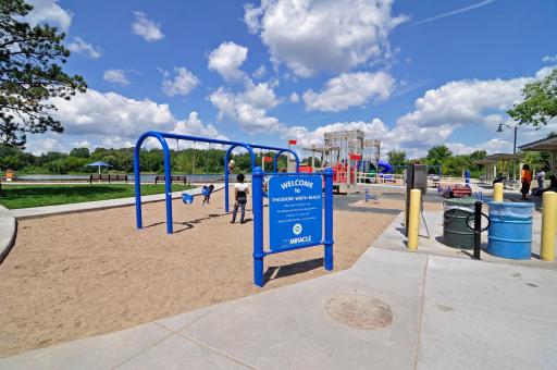 Theo Wirth Beach - A sandy lakeside beach perfect for swimming, paddleboarding, kayaking, picnics, and enjoying warm Minnesota summer days close to home.