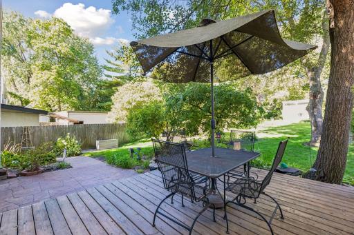 This home features a large deck and multiple patio areas overlook the beautifully landscaped yard, complete with mature gardens, a peaceful pond and a storage shed designed to complement the home.