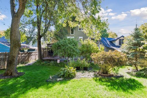 The fenced lot extends more than 200 feet deep, creating a remarkable sense of
space and privacy in the city.