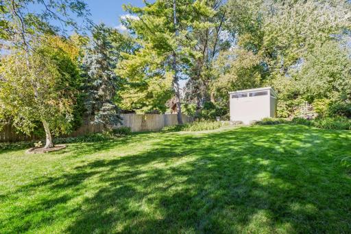 The fenced lot extends more than 200 feet deep, creating a remarkable sense of
space and privacy in the city.