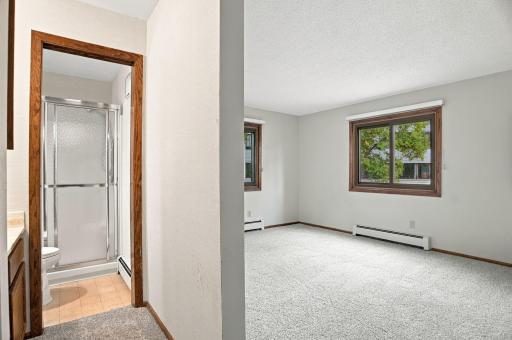 Primary Bedroom w/ Ensuite Bath + Walk In Closet
