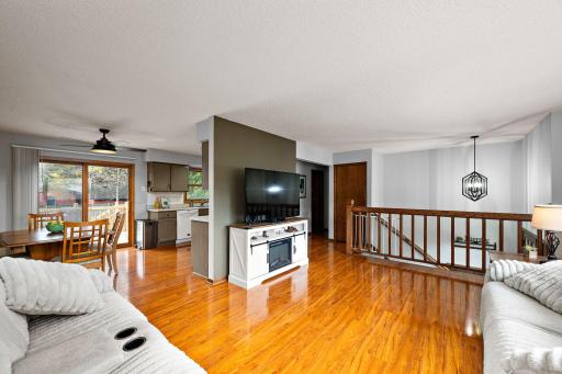 Open main floor layout with a bright living room with gleaming hardwood floors and an updated kitchen!