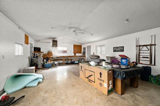 GARAGE LOVER'S DREAM: Heated and insulated 4-car garage (24x22 + 28x20) equipped with a 220V outlet and two service doorsâideal for vehicles, toys, and a workshop!