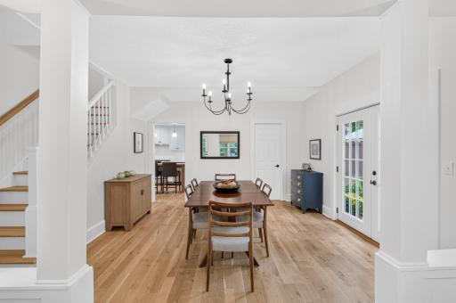 Warm white oak hardwood floors flow throughout the main level, adding warmth & timeless appeal.