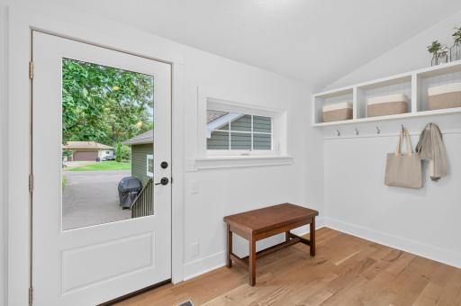 Just off the kitchen, a convenient side entry creates the perfect drop zone for everyday arrivals, gear, and life on the go.