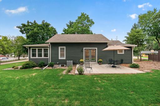 The spacious 18x14 concrete patio sets the scene for sunny afternoons, a favorite beverage, and time spent outdoors.