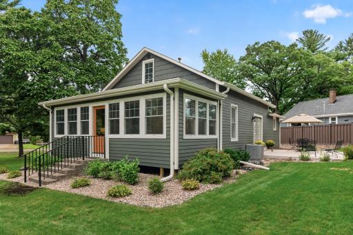Freshly painted siding, new exterior doors, refined exterior lighting, & custom railings complement the home's classic architectural character.
