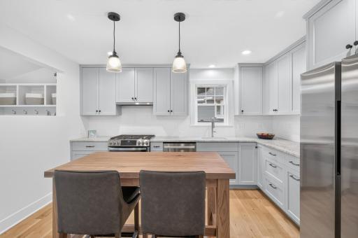Fully redesigned kitchen anchored by superb custom cabinetry.