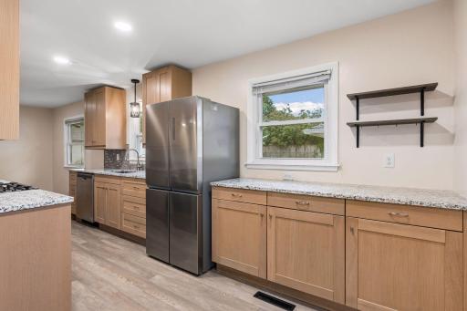 Plenty of countertop space makes this kitchen ideal for channeling your inner coffee barista—set up your favorite coffee station, display your go-to mugs, and still have room to prep and entertain.
