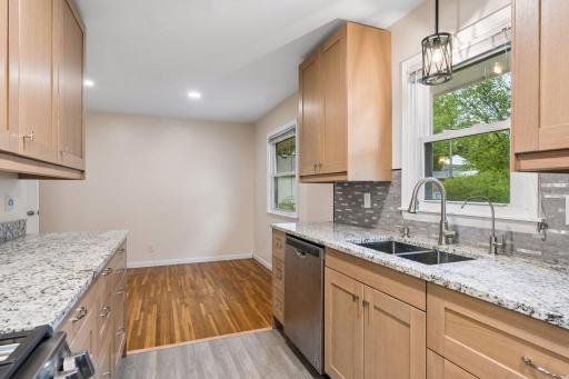 Stunning remodeled kitchen — 2026: Brand-new cabinetry, granite countertops, stylish backsplash, stainless-steel appliances, smart gas range with air-fry & convection, pantry, under-cabinet lighting, and luxury vinyl flooring.