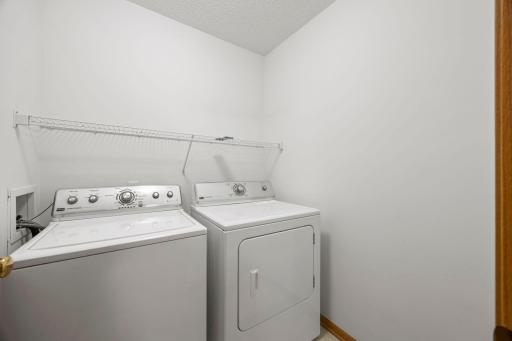 The well-appointed laundry room is conveniently located on the upper level.