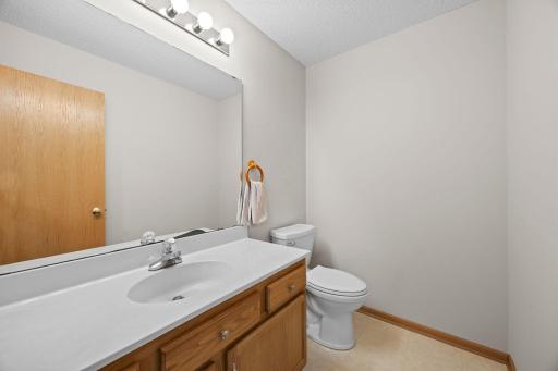 The kitchen provides convenient access to the half bath and attached two-car garage