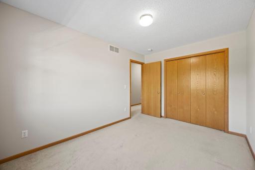 An alternative view of Bedroom Two highlighting its comfortable layout.