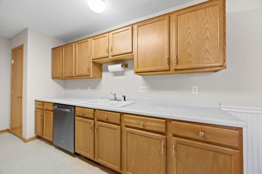 A different perspective showcasing the abundant cabinetry.