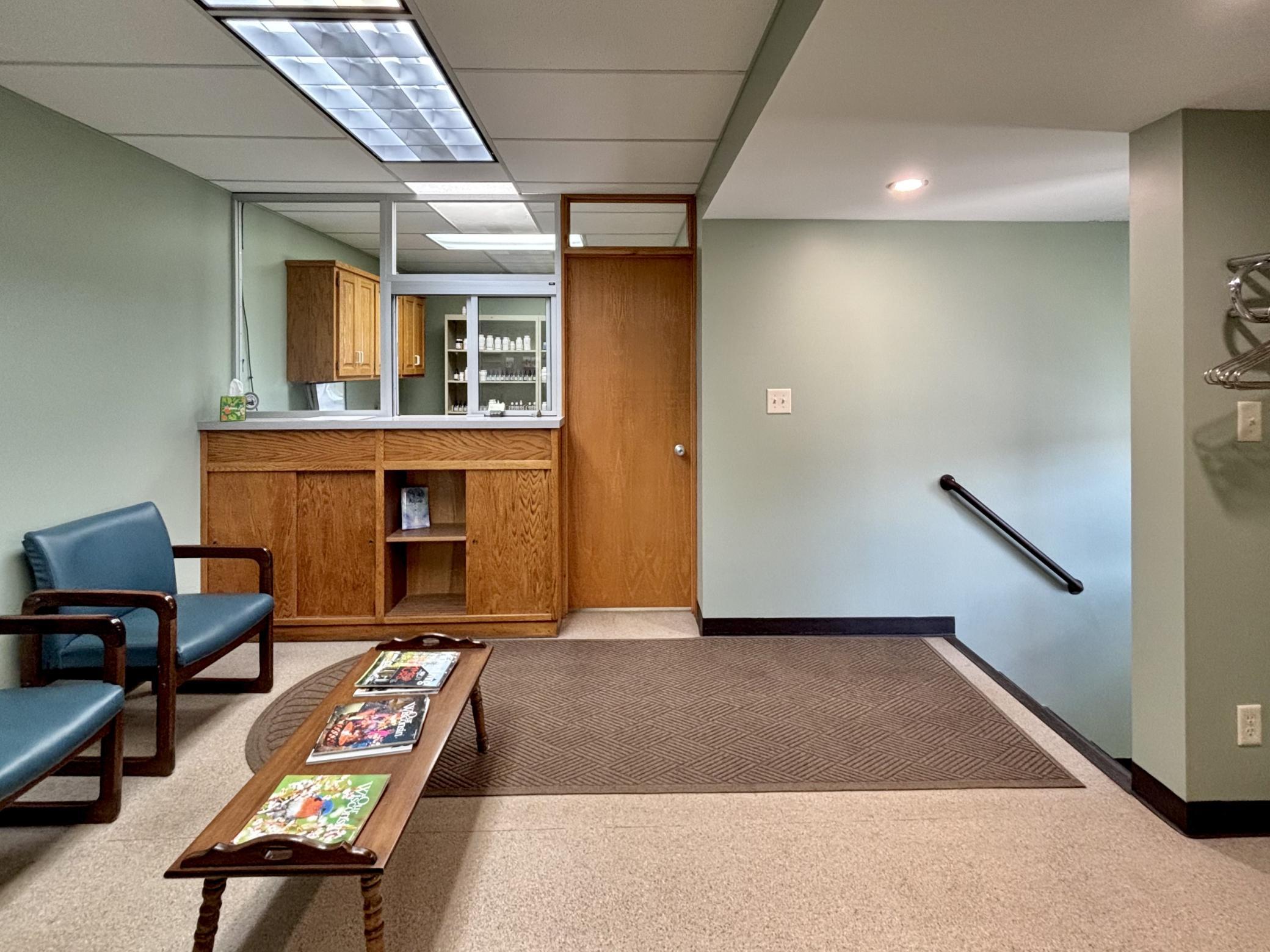 A look here at the behind the counter area of the reception space. To the right of that is a private office space.