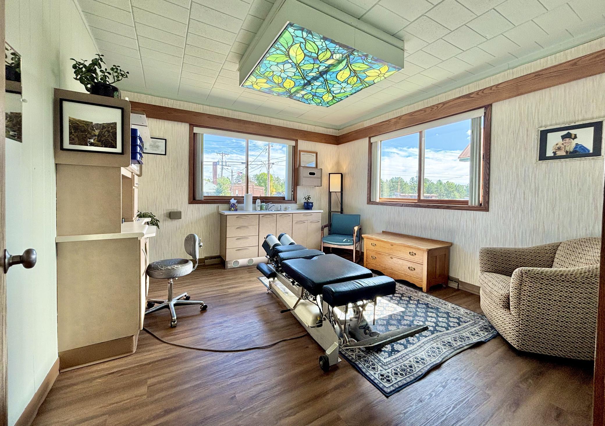 One of the patient treatment rooms with enriching new maintenance free flooring. Two more rooms just like this that are being painted. Love the double windows here and all the natural light.