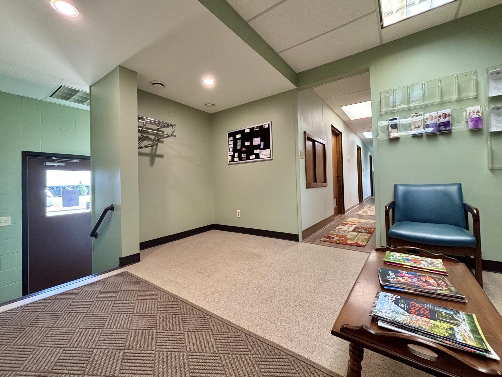 Another angle of the roomy reception area and front entry along with an open coat closet space.
