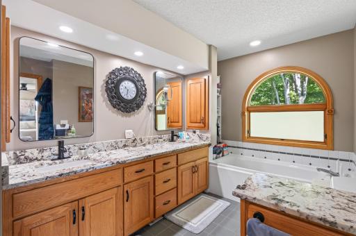 Recessed lighting and arched window bring in the light