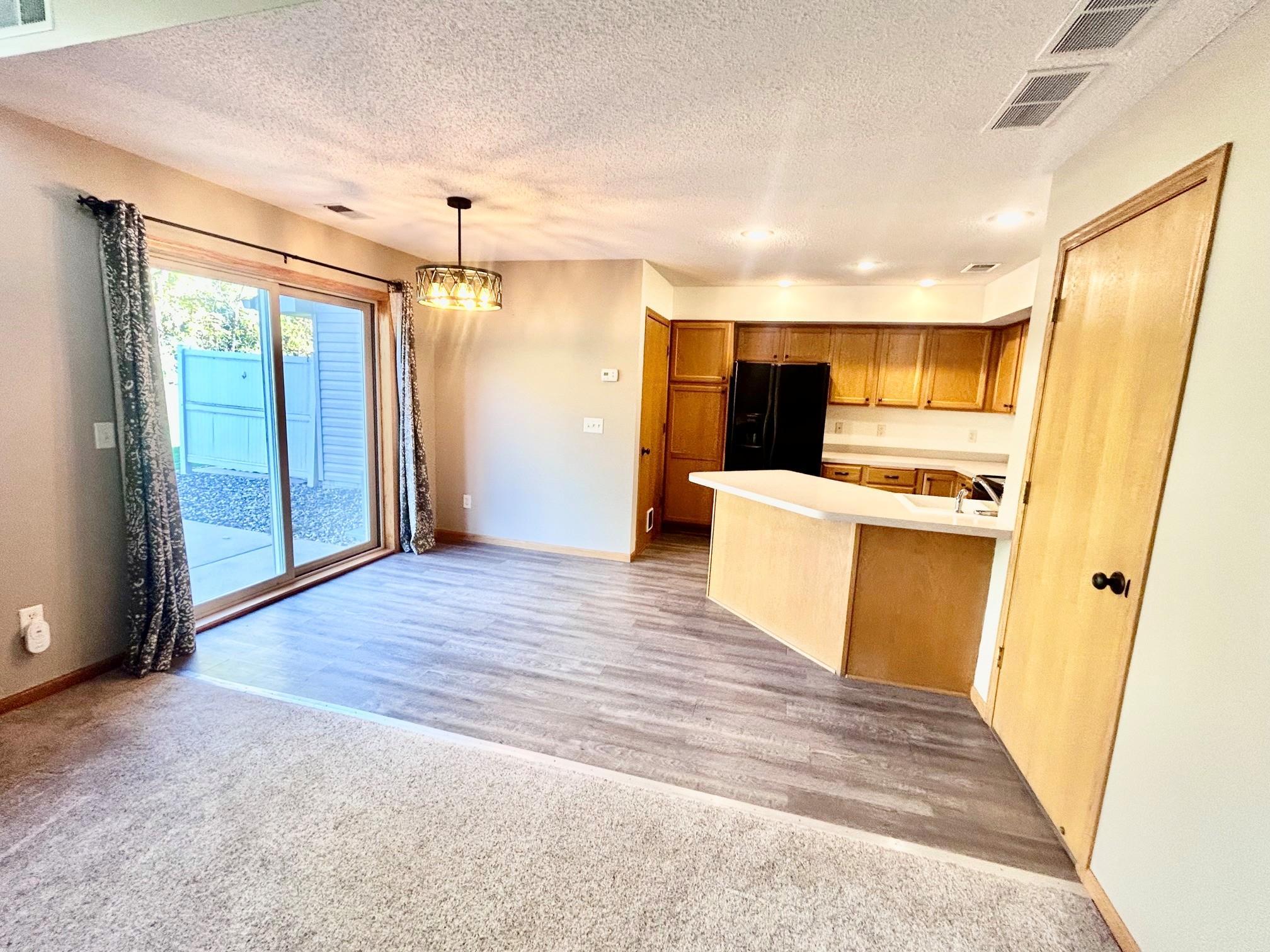 Looking at kitchen and dining area