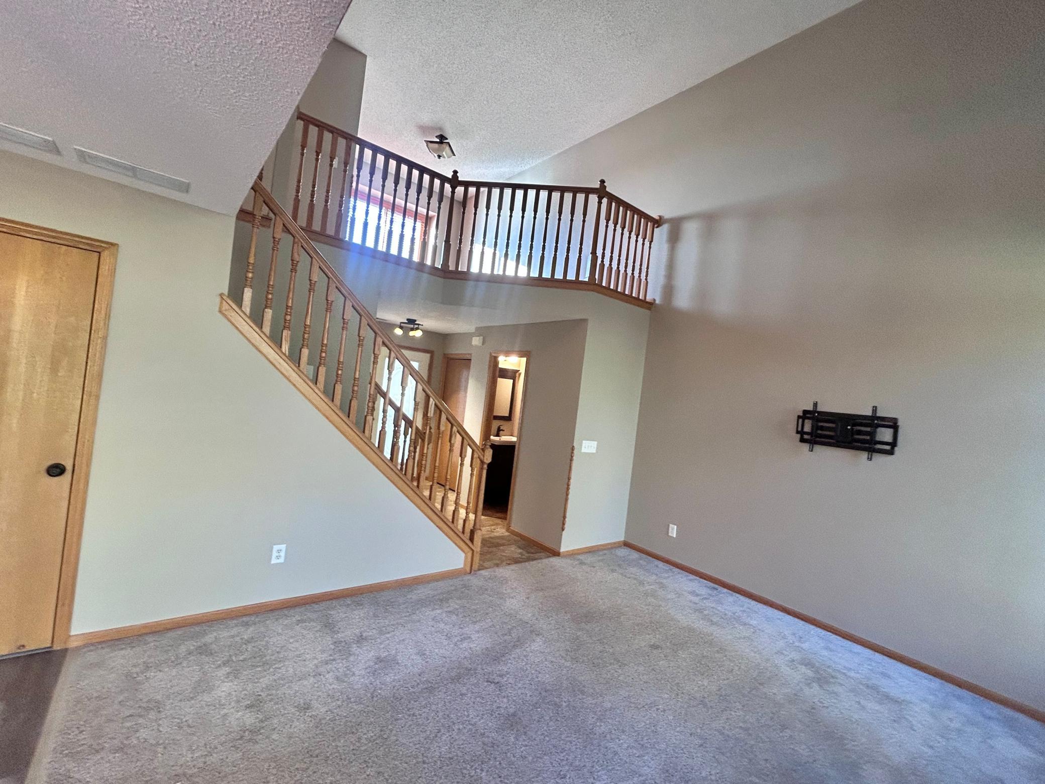 View from the dining area to stairs to the upper level
