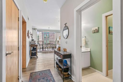 A spacious open sightline leads toward the main living area, while an adjacent bathroom adds convenience.