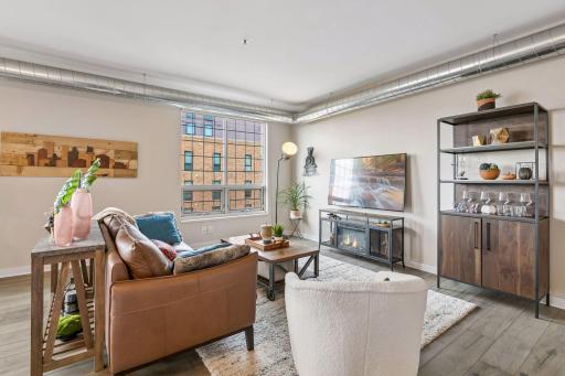 Oversized windows fill the space with natural light.