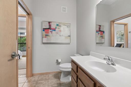 Large bathroom is split into 2 private sections