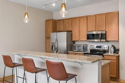 Pull up a stool and stay awhile. The center island adds both workspace and casual seating, making it easy to chat with the cook, enjoy a quick meal or spread out while working from home.