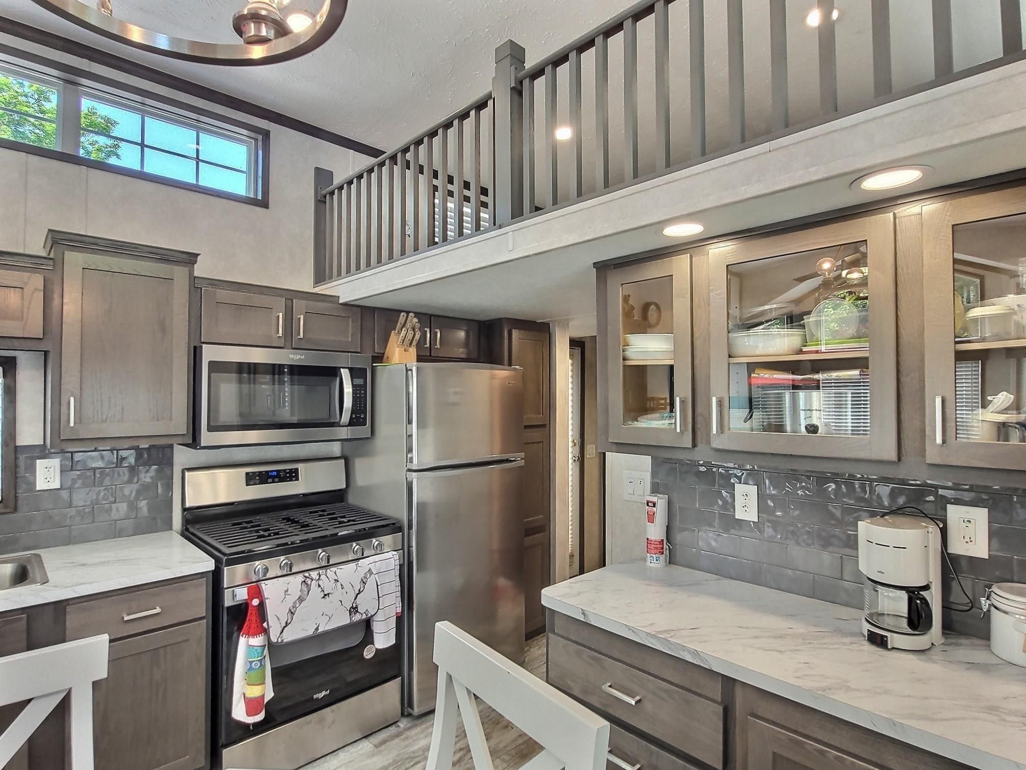Stainless steel appliances, upgraded back splash and cabinets.