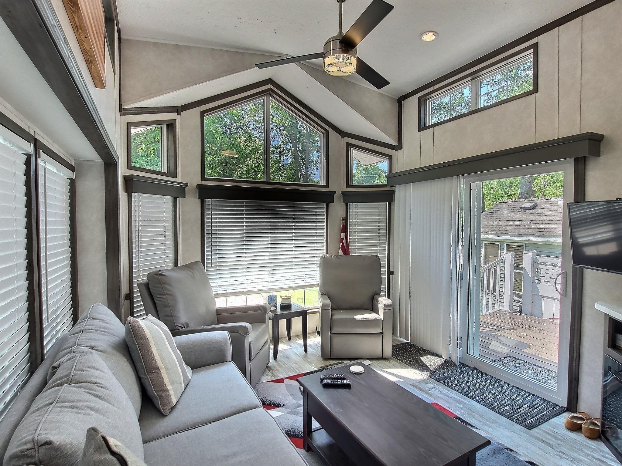 The living room area with direct access to large side deck.