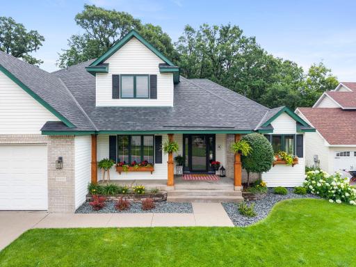 A beautifully landscaped yard shows pride of ownership.