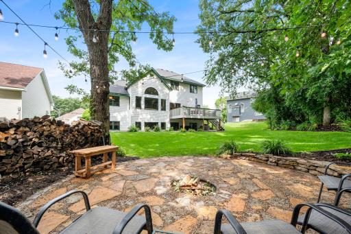 A cozy firepit area is ready for fall evenings in the backyard.