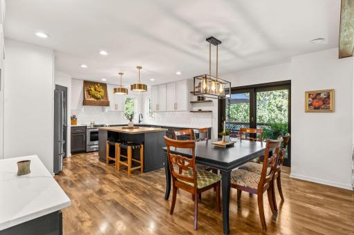 The kitchen and dining room provide access to the deck and backyard.