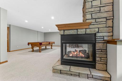 The basement recreation room features the home's second fireplace.