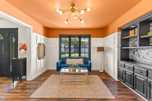 A flexible room with built in cabinetry near the front door could be used as a formal dining room.
