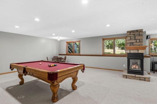 The basement has space for entertaining, games, and storage.