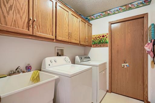 Oversized laundry room with utility closet