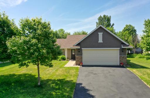 Beautifully landscaped front yard welcomes you home.