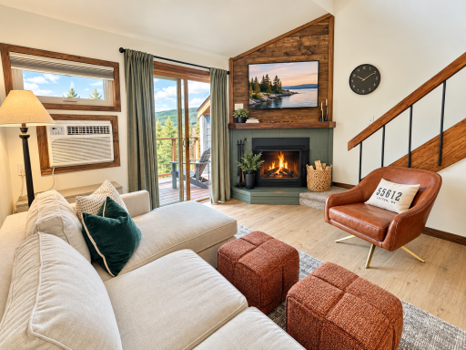 Living room with cozy wood burning fireplace.png