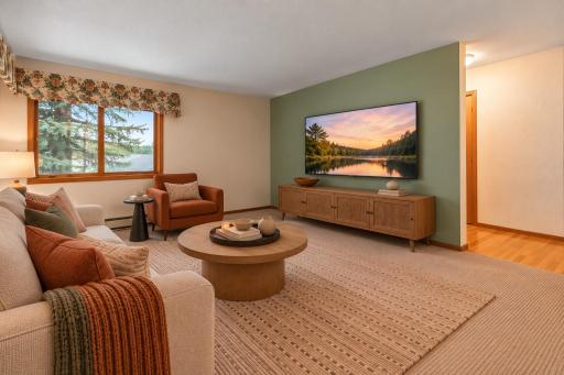 A versatile living room gives you plenty of options for arranging the space to fit your lifestyle, with an easy flow and generous wall space for a variety of uses. (Virtually staged photo.)