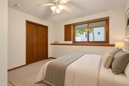 The second lower-level bedroom offers a comfortable retreat with a large window and flexibility for guests, family or a home office. (Virtually staged photo.)