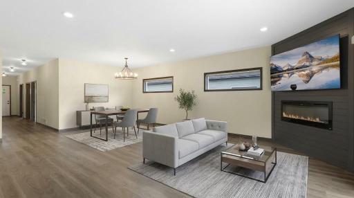 Open-concept living room and dining room. (Virtually staged)