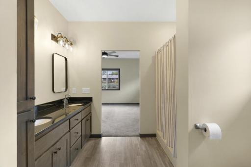 Primary bathroom with double sinks and lots of storage in the cupboards. .